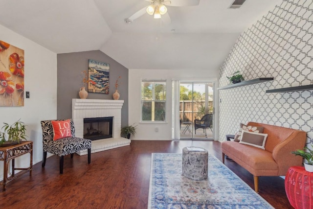 12316 Sugar Leaf Pl, Austin, TX 78748 - living room with vaulted ceiling, wood finished floors, a ceiling fan, and a fireplace