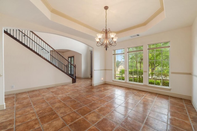 12029 Portobella Dr, Austin, TX 78732 - unfurnished living room with arched walkways, a tray ceiling, ornamental molding, baseboards, and a chandelier