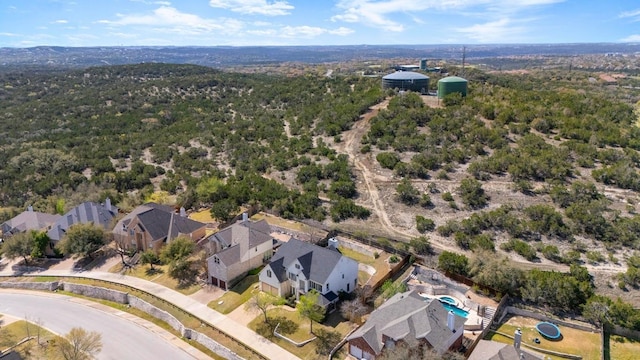 12029 Portobella Dr, Austin, TX 78732 - aerial view of property's location with nearby suburban area and a heavily wooded area