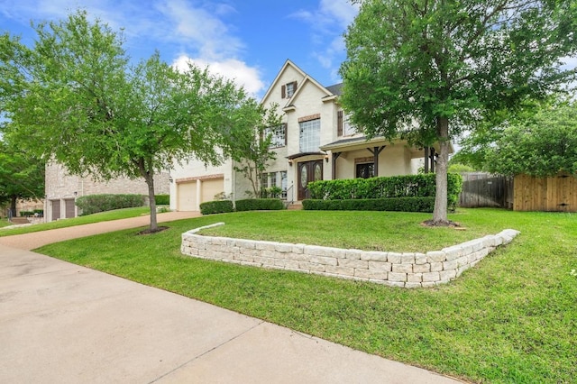 12029 Portobella Dr, Austin, TX 78732 - view of front of house featuring driveway, an attached garage, and stucco siding
