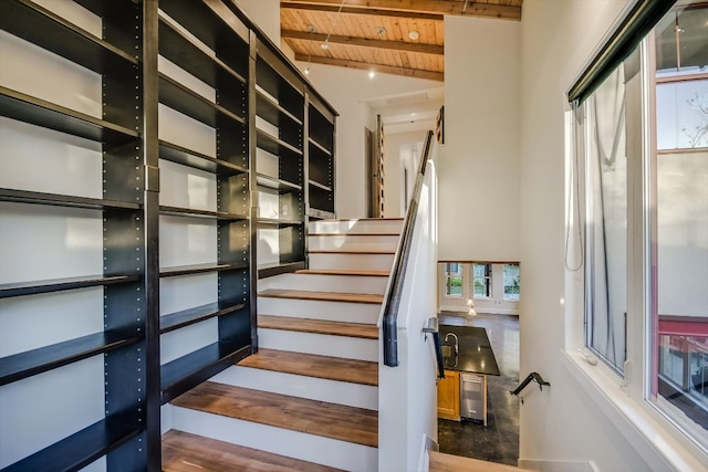 1701 Ravey St, Austin, TX 78704 - staircase with wood ceiling and wood finished floors