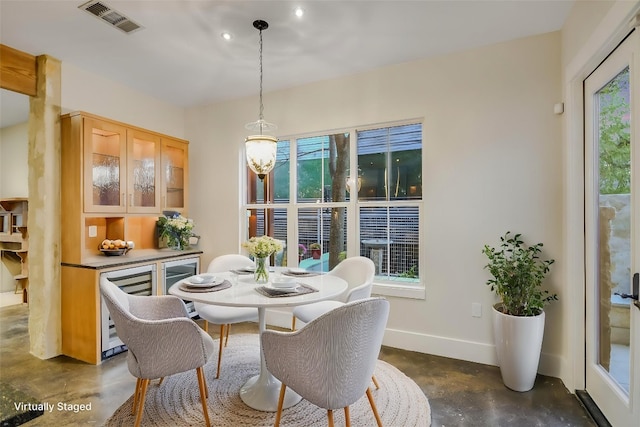 1701 Ravey St, Austin, TX 78704 - dining area with finished concrete flooring and baseboards