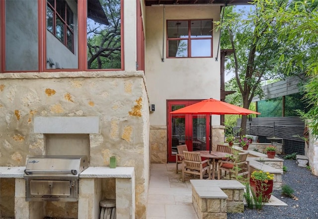 1701 Ravey St, Austin, TX 78704 - view of patio with outdoor dining area and an outdoor kitchen