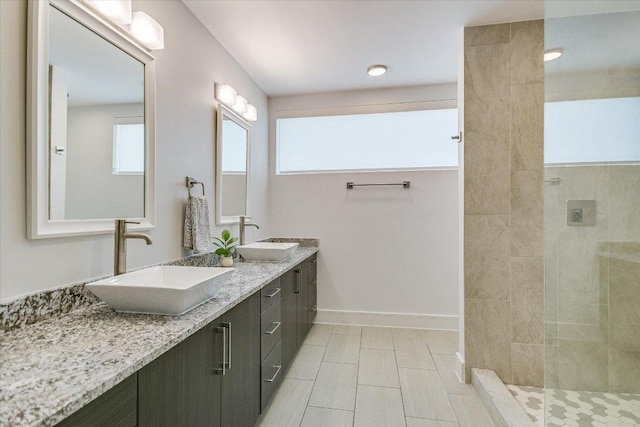 1715 Enfield Rd Unit 302, Austin, TX 78703 - bathroom featuring double vanity and a walk in shower