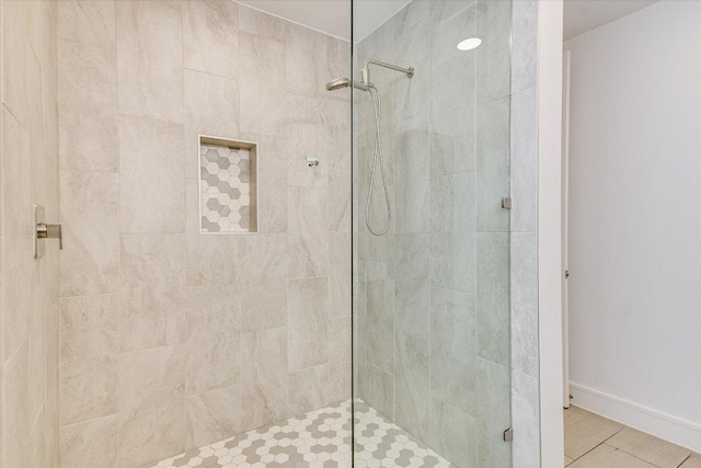 1715 Enfield Rd Unit 302, Austin, TX 78703 - bathroom with tiled shower and baseboards