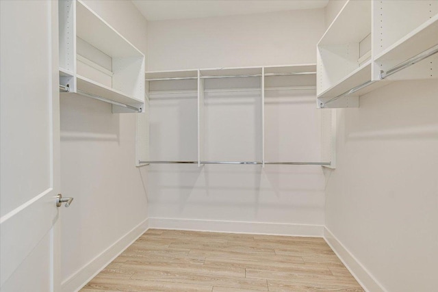 1715 Enfield Rd Unit 302, Austin, TX 78703 - walk in closet with wood finished floors