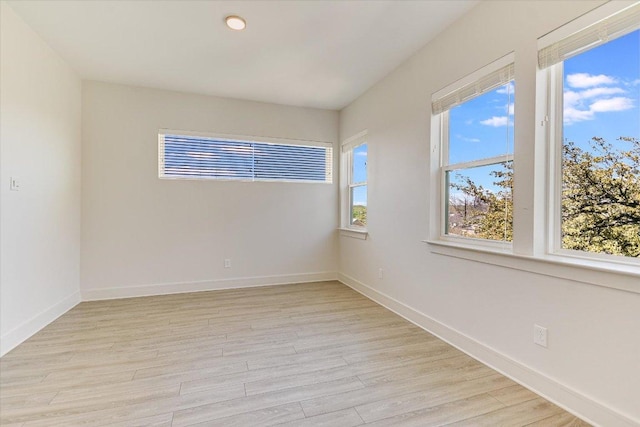 1715 Enfield Rd Unit 302, Austin, TX 78703 - unfurnished room with light wood-type flooring and baseboards