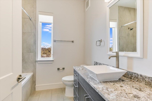 1715 Enfield Rd Unit 302, Austin, TX 78703 - bathroom featuring vanity, a tile shower, and tile patterned floors