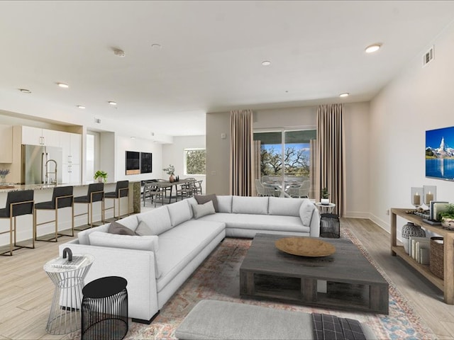 1715 Enfield Rd Unit 302, Austin, TX 78703 - living area with light wood-type flooring and recessed lighting