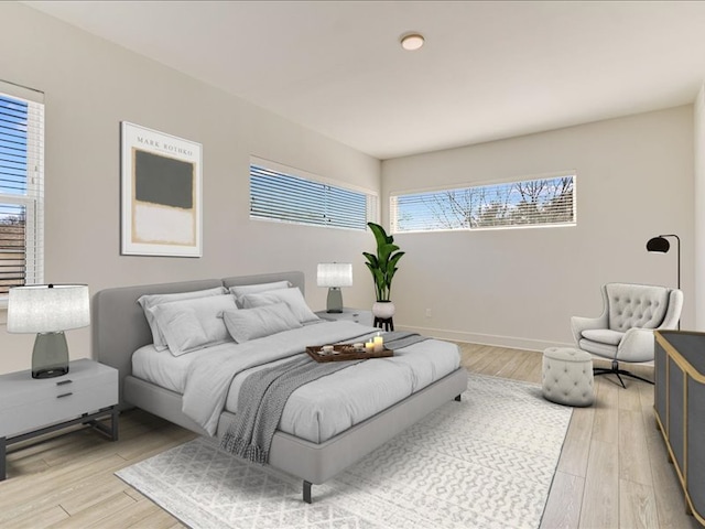 1715 Enfield Rd Unit 302, Austin, TX 78703 - bedroom featuring multiple windows and light wood finished floors