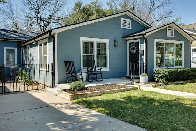 1907 W 36th St, Austin, TX 78731 - view of front of house with a porch and a front lawn
