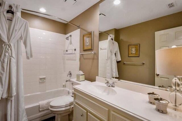 10105 Shinnecock Hills Dr, Austin, TX 78747 - bathroom with shower / bath combo, vanity, toilet, and recessed lighting