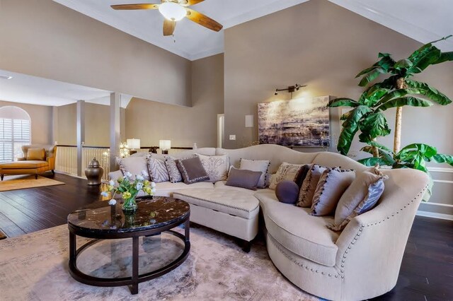 10105 Shinnecock Hills Dr, Austin, TX 78747 - living area with wood finished floors, a ceiling fan, a towering ceiling, and baseboards
