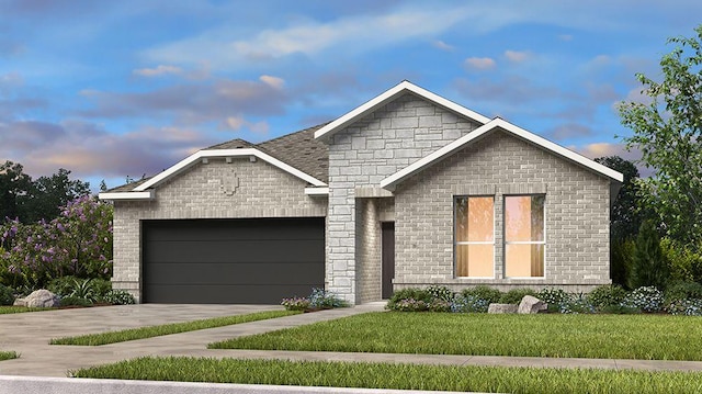 309 Golden Sage Ave, Georgetown, TX 78633 - view of front of house featuring an attached garage, driveway, brick siding, and a front yard
