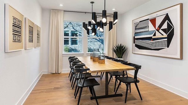 309 Golden Sage Ave, Georgetown, TX 78633 - dining space with a chandelier, wood finished floors, and recessed lighting