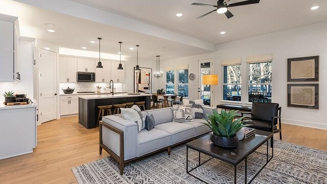 309 Golden Sage Ave, Georgetown, TX 78633 - living area with ceiling fan, recessed lighting, and light wood-type flooring
