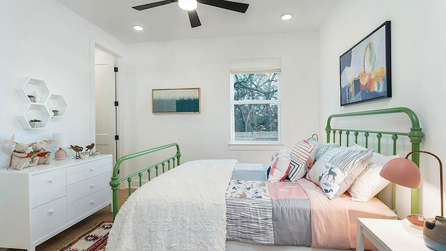 309 Golden Sage Ave, Georgetown, TX 78633 - bedroom with wood finished floors, recessed lighting, and a ceiling fan