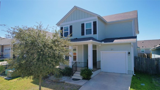 233 Quemado Dr, Leander, TX 78641 - craftsman-style home with board and batten siding, a porch, an attached garage, concrete driveway, and roof with shingles
