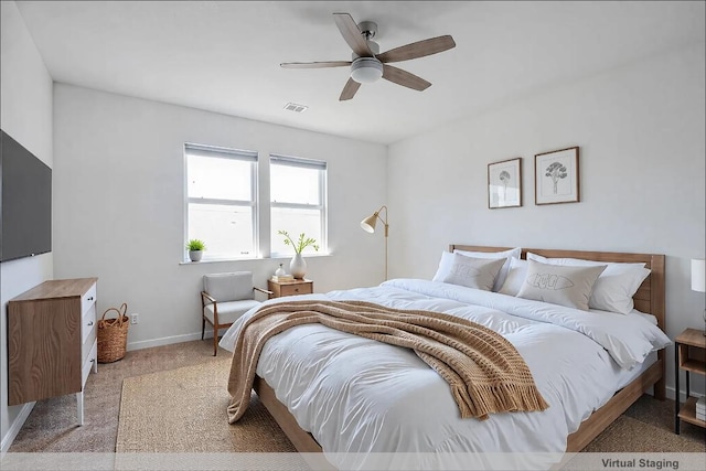 bedroom with visible vents, baseboards, a ceiling fan, and carpet floors