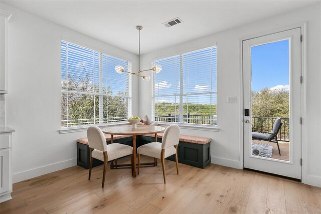 9943 Derecho Dr, Austin, TX 78737 - dining space featuring baseboards, light wood-type flooring, and healthy amount of natural light