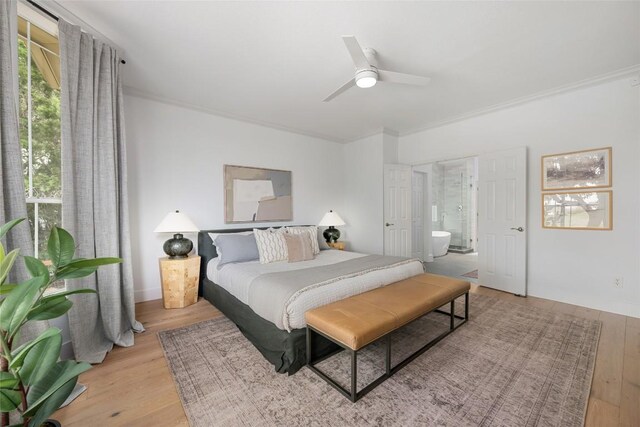 9943 Derecho Dr, Austin, TX 78737 - bedroom with wood finished floors, crown molding, ceiling fan, and ensuite bathroom