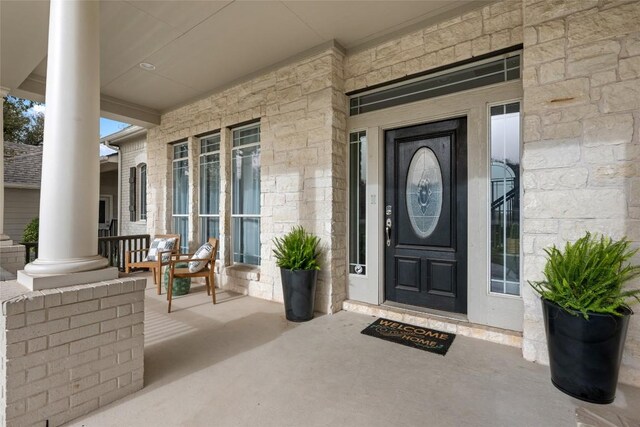 9943 Derecho Dr, Austin, TX 78737 - view of exterior entry with a porch and stone siding
