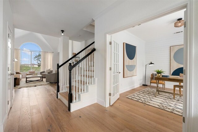9943 Derecho Dr, Austin, TX 78737 - entrance foyer with wood-type flooring, stairway, and baseboards