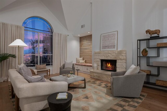9943 Derecho Dr, Austin, TX 78737 - living room with wood finished floors, high vaulted ceiling, and a stone fireplace