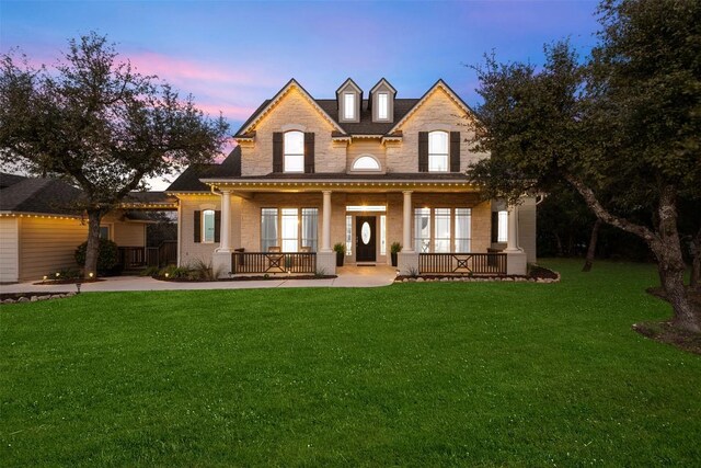 9943 Derecho Dr, Austin, TX 78737 - back of property with a porch, a yard, and brick siding