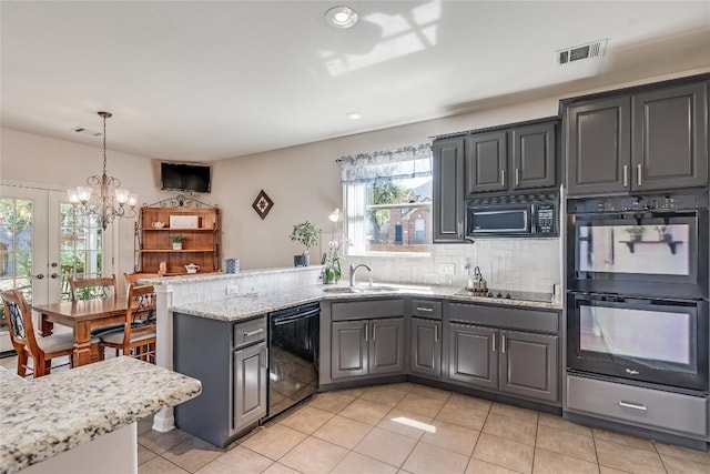 2535 Crenshaw Dr, Round Rock, TX 78664 - kitchen with black appliances, a sink, a peninsula, gray cabinetry, and tasteful backsplash