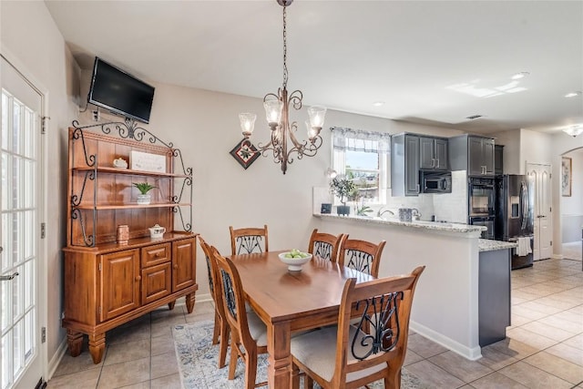 2535 Crenshaw Dr, Round Rock, TX 78664 - dining space with a chandelier, light tile patterned flooring, recessed lighting, and baseboards