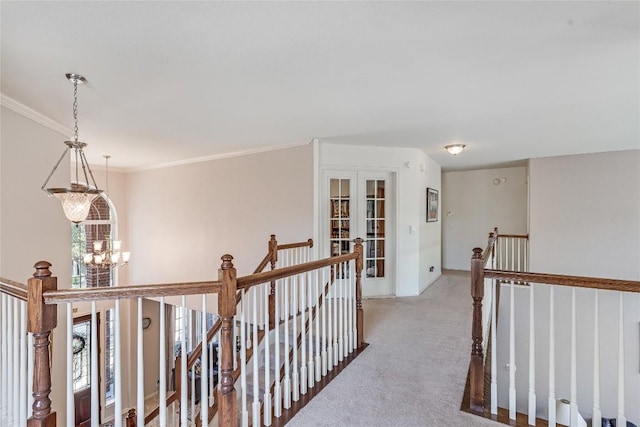 2535 Crenshaw Dr, Round Rock, TX 78664 - hall featuring an upstairs landing, a chandelier, carpet floors, healthy amount of natural light, and crown molding