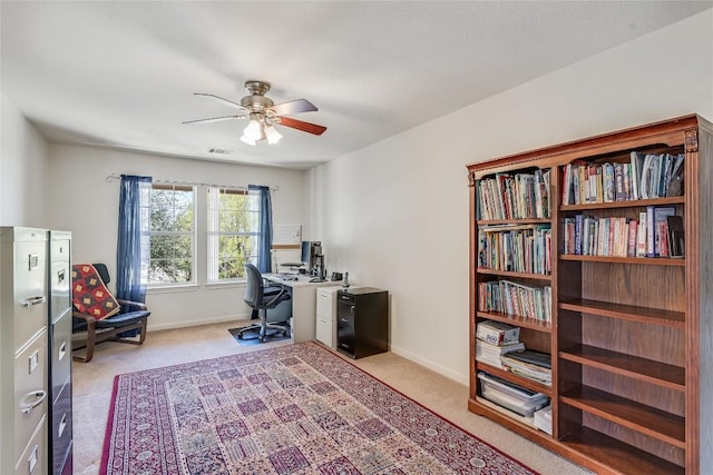 2535 Crenshaw Dr, Round Rock, TX 78664 - carpeted home office with ceiling fan and baseboards