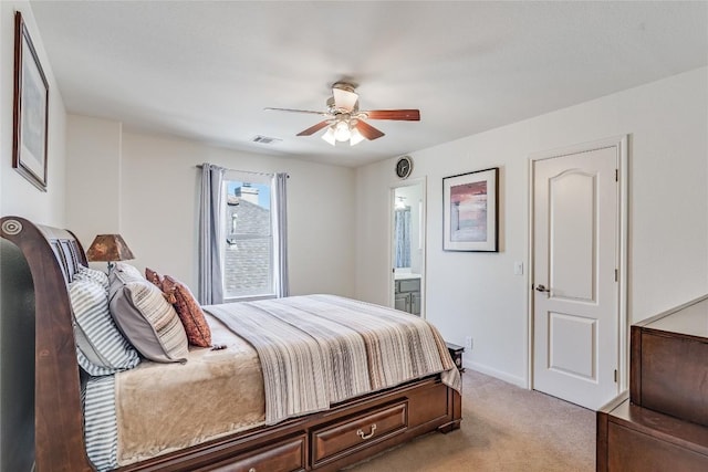2535 Crenshaw Dr, Round Rock, TX 78664 - bedroom featuring light carpet, connected bathroom, baseboards, and a ceiling fan