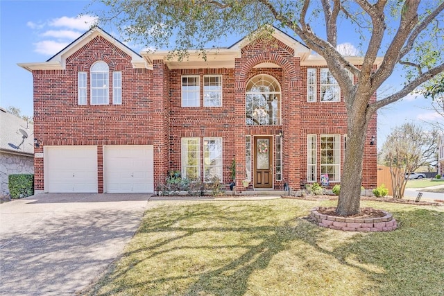colonial inspired home featuring brick siding, an attached garage, a front yard, and concrete driveway