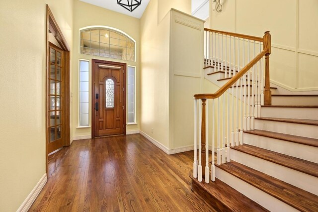 5903 Cane Pace, Austin, TX 78746 - foyer entrance featuring wood finished floors, stairway, and baseboards