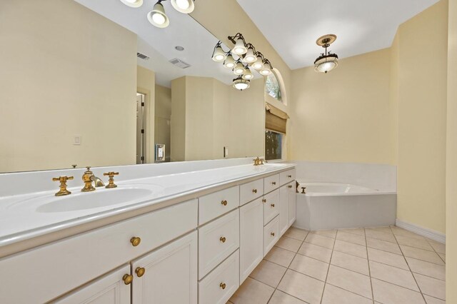 5903 Cane Pace, Austin, TX 78746 - full bath with double vanity, tile patterned flooring, a garden tub, and baseboards