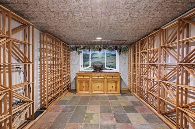 5903 Cane Pace, Austin, TX 78746 - wine room with dark stone finish flooring and an ornate ceiling