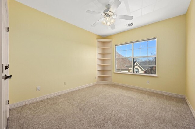 5903 Cane Pace, Austin, TX 78746 - unfurnished room featuring light carpet, baseboards, and a ceiling fan