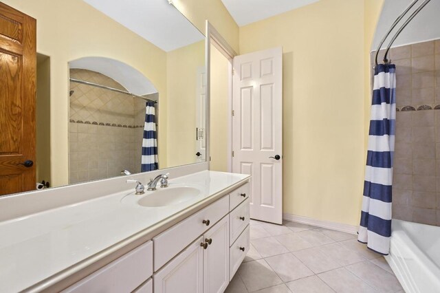 5903 Cane Pace, Austin, TX 78746 - full bathroom featuring vanity, tile patterned flooring, and shower / bath combo with shower curtain