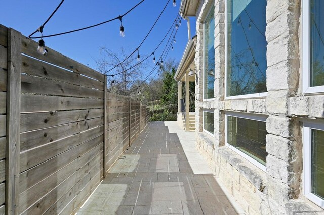 5903 Cane Pace, Austin, TX 78746 - view of side of home featuring a patio