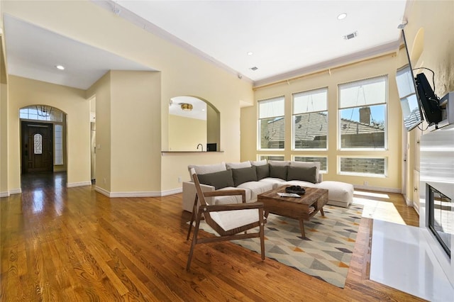 5903 Cane Pace, Austin, TX 78746 - living room featuring wood finished floors, baseboards, recessed lighting, and arched walkways
