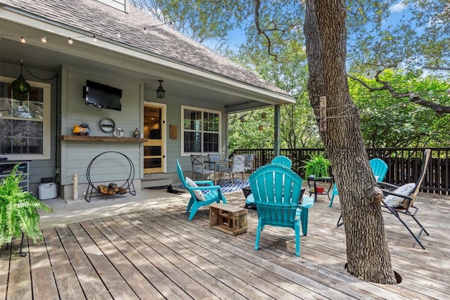wooden terrace featuring outdoor dining space
