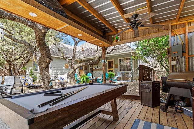wooden terrace featuring grilling area and ceiling fan