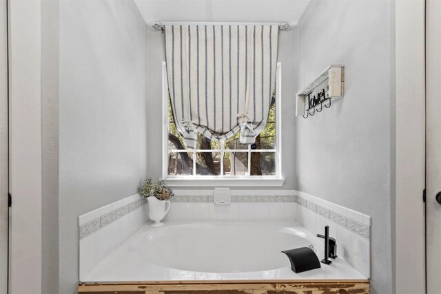 full bath with a garden tub