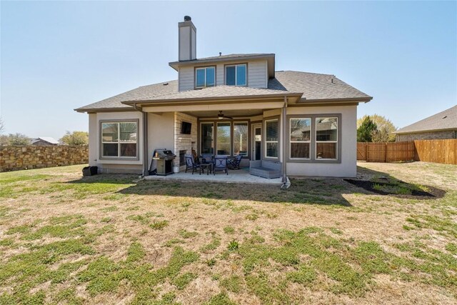 100 Adorno Ln, Georgetown, TX 78628 - rear view of property with a ceiling fan, a patio area, and a chimney