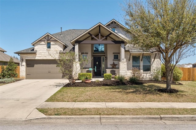 100 Adorno Ln, Georgetown, TX 78628 - craftsman-style house with stone siding, driveway, and a garage