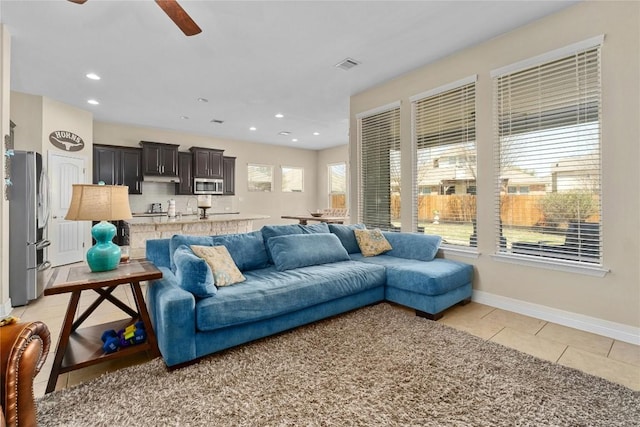 100 Adorno Ln, Georgetown, TX 78628 - living area with a ceiling fan, light tile patterned flooring, recessed lighting, and baseboards