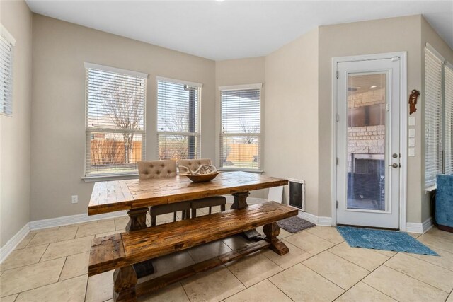 100 Adorno Ln, Georgetown, TX 78628 - dining room with baseboards and light tile patterned floors