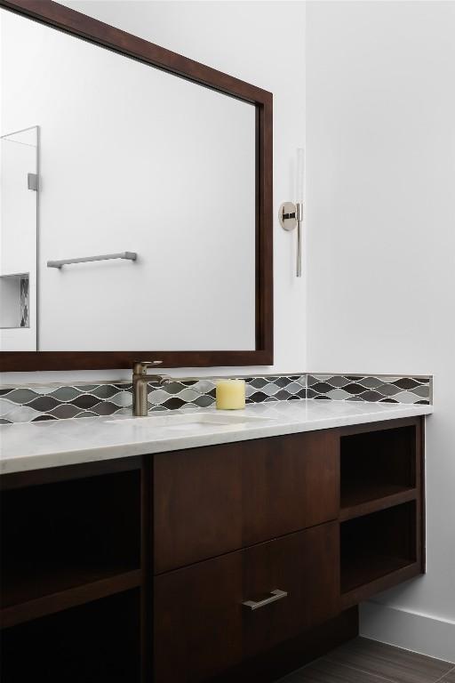 4704 Timberline Dr, Austin, TX 78746 - bathroom featuring backsplash and vanity